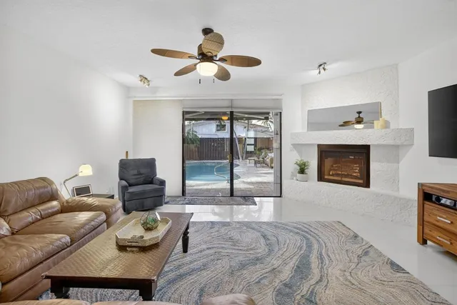 a kitchen with stainless steel appliances granite countertop a sink dishwasher and cabinets with wooden floor