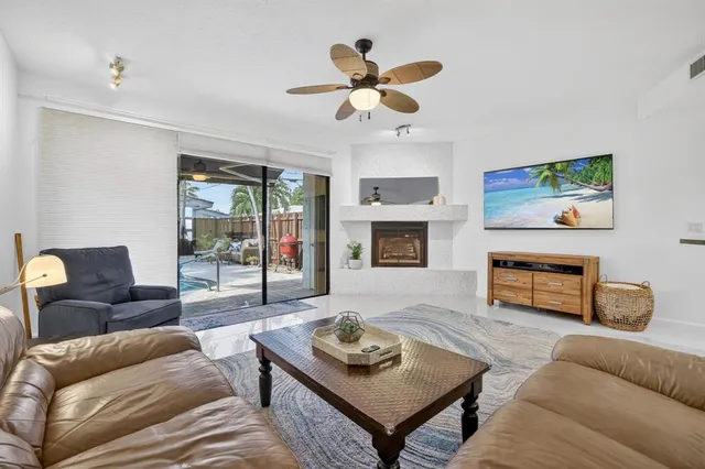 a kitchen with granite countertop a refrigerator and a stove top oven
