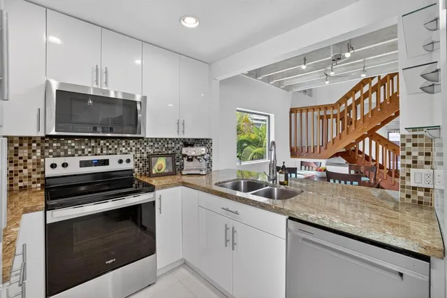 a living room with furniture and next to a window