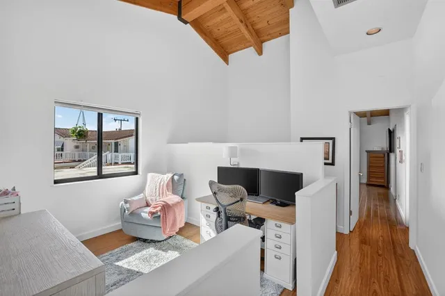 a view of a wooden deck with a yard