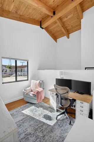 a view of walk in closet with clothes