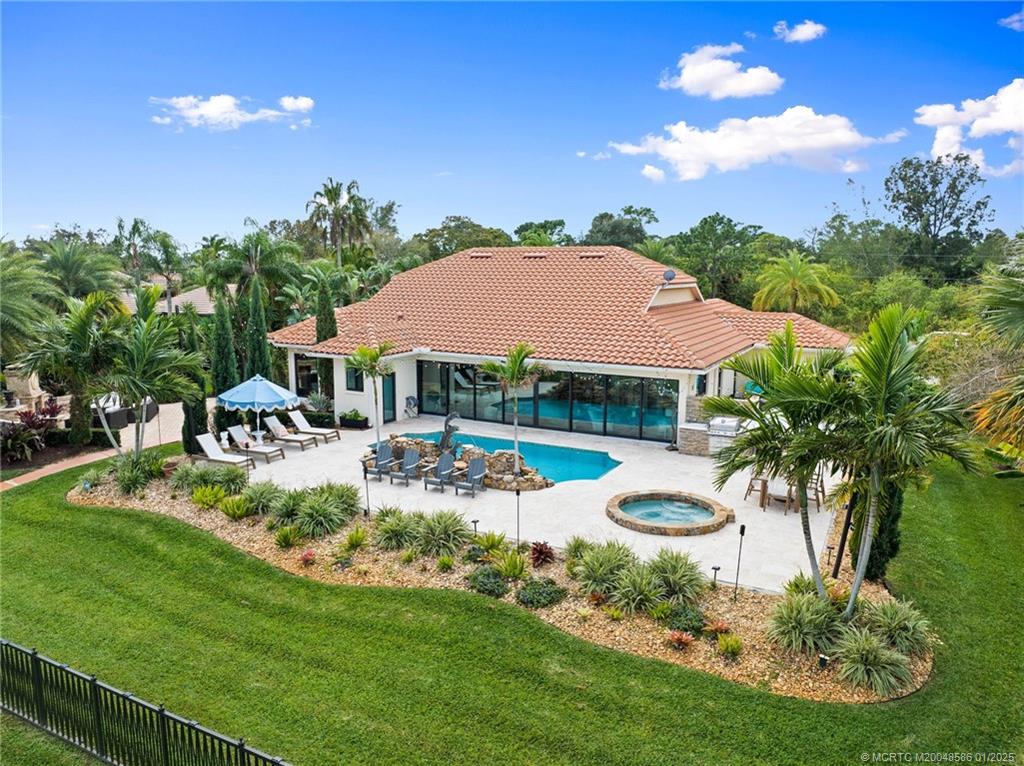 12038 Riverbend Road Port St. Lucie, FL 34984 - Photo 11 of 86 a view of a house with swimming pool garden and patio