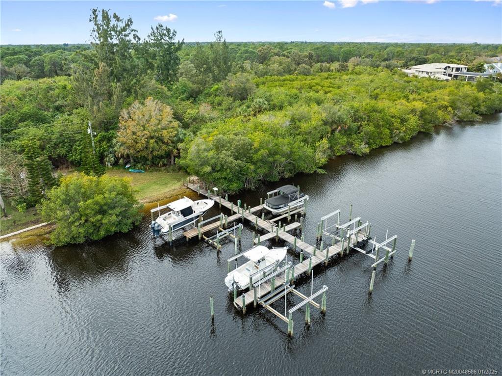 12038 Riverbend Road Port St. Lucie, FL 34984 - Photo 20 of 86 a view of a lake with outdoor seating space