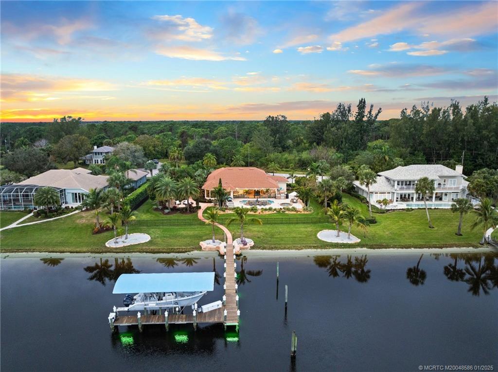 12038 Riverbend Road Port St. Lucie, FL 34984 - Photo 23 of 86 an aerial view of a house with yard swimming pool and outdoor seating