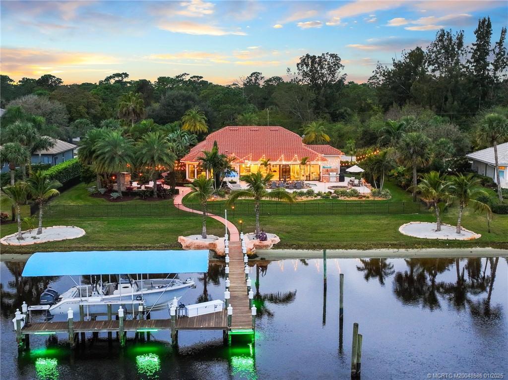 12038 Riverbend Road Port St. Lucie, FL 34984 - Photo 27 of 86 an aerial view of a house with garden space pool patio and outdoor seating