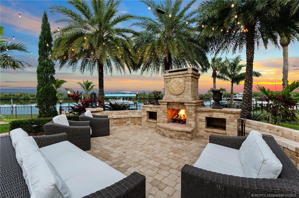 12038 Riverbend Road Port St. Lucie, FL 34984 - Photo 41 of 86 a view of a swimming pool with couches and lounge chairs