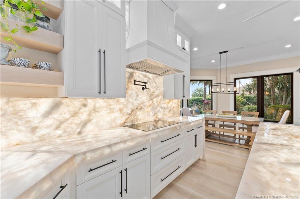 12038 Riverbend Road Port St. Lucie, FL 34984 - Photo 66 of 86 a large white kitchen with a large window