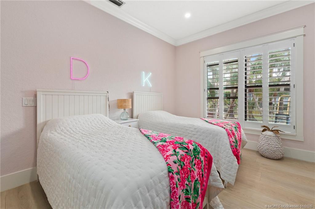 12038 Riverbend Road Port St. Lucie, FL 34984 - Photo 86 of 86 a bedroom with a bed and window