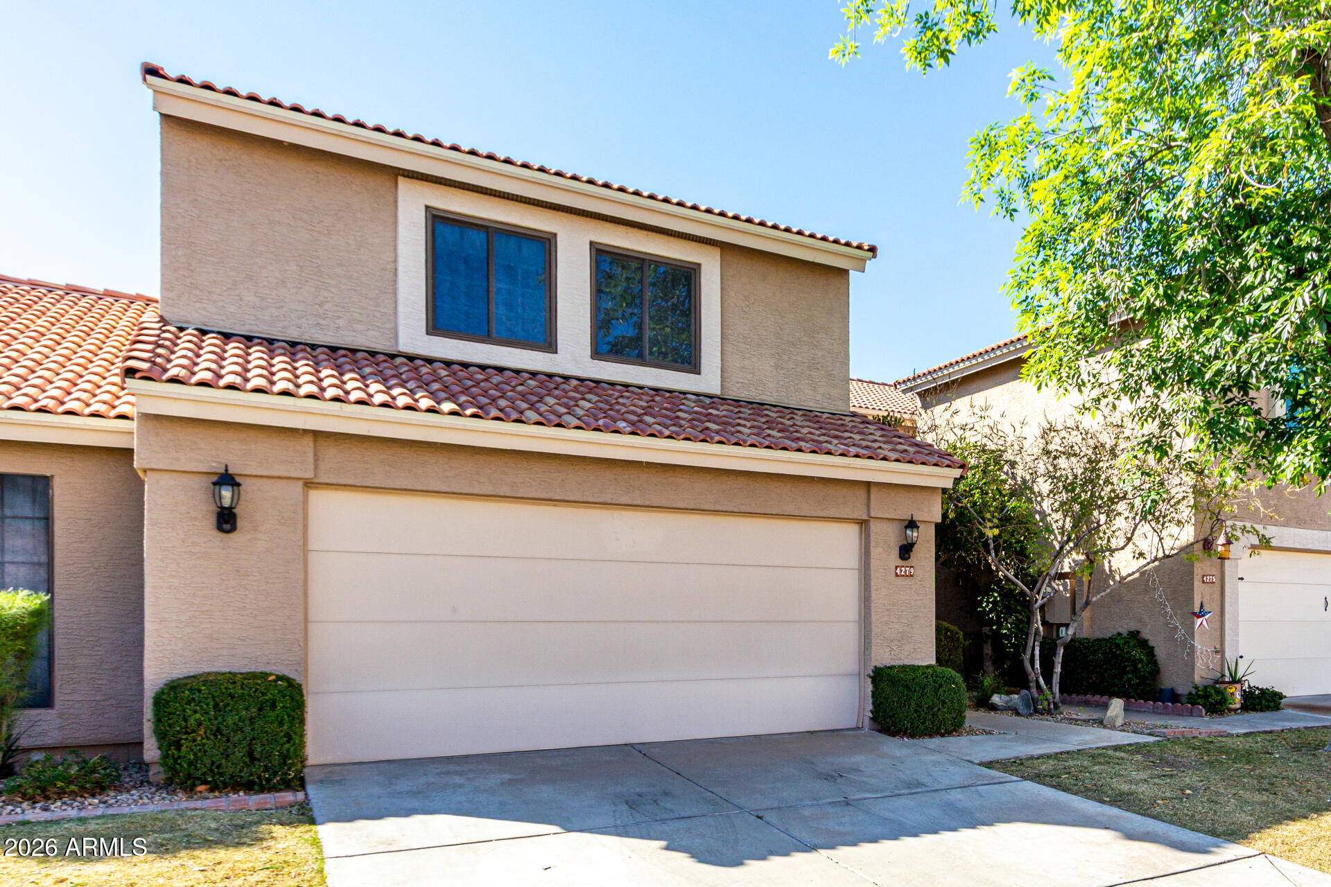 4279 East Agave Road Phoenix, AZ 85044 - Photo 1 of 31 a front view of a house with garden