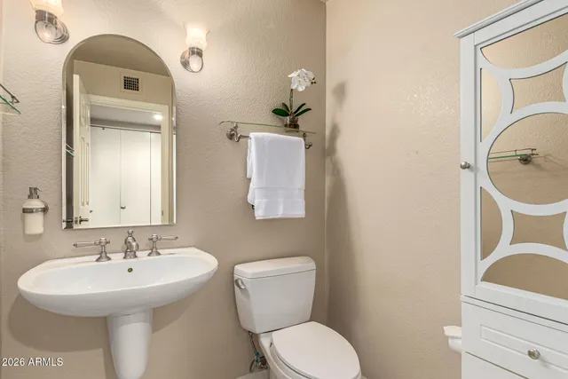 a spacious bathroom with a double vanity sink and a mirror