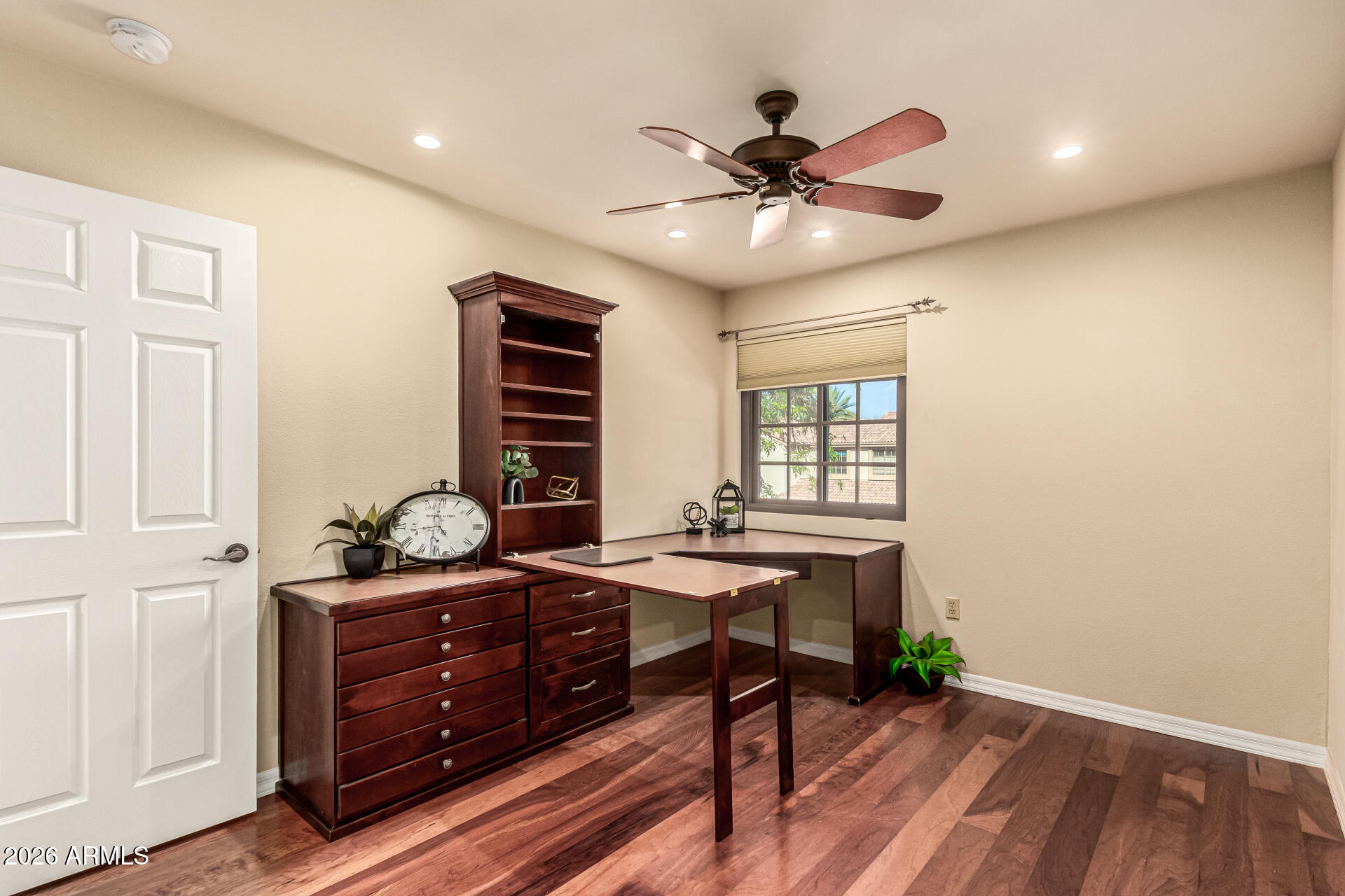 4279 East Agave Road Phoenix, AZ 85044 - Photo 21 of 31 a view of a workspace with furniture and a window