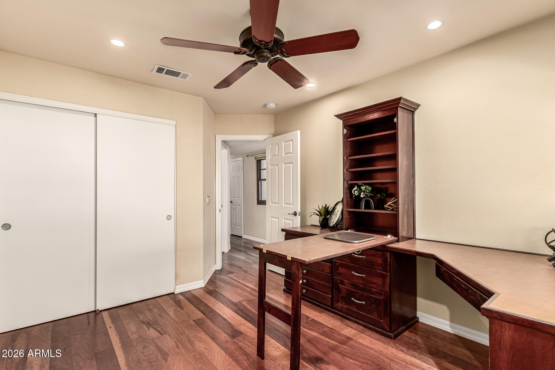 4279 East Agave Road Phoenix, AZ 85044 - Photo 22 of 31 a view of a workspace with furniture and wooden floor