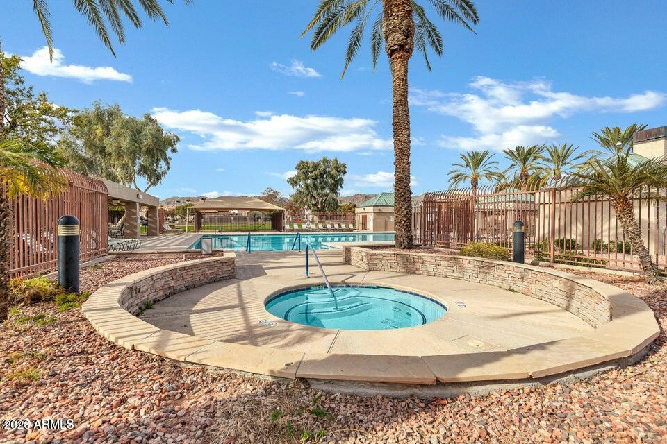 4279 East Agave Road Phoenix, AZ 85044 - Photo 30 of 31 a view of a swimming pool with a patio