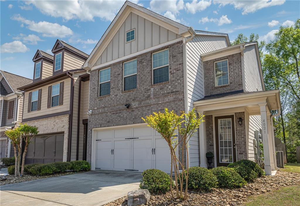 4021 Princeton Lakes Pass Southwest Atlanta, GA 30331 - Photo 2 of 23 a front view of a house with garden