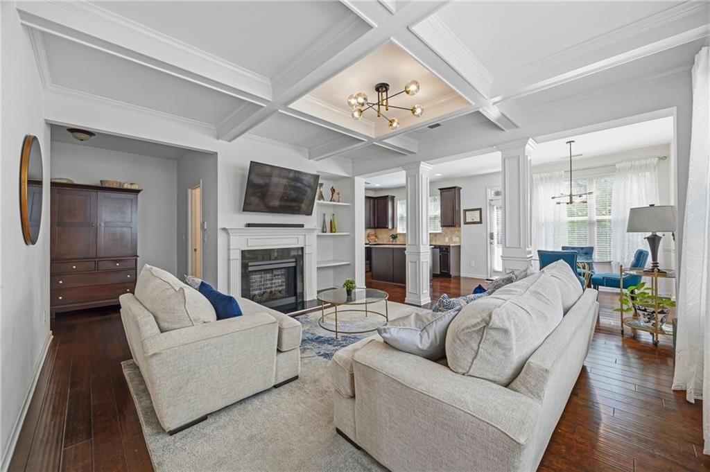 4021 Princeton Lakes Pass Southwest Atlanta, GA 30331 - Photo 4 of 23 a living room with furniture a fireplace and a flat screen tv