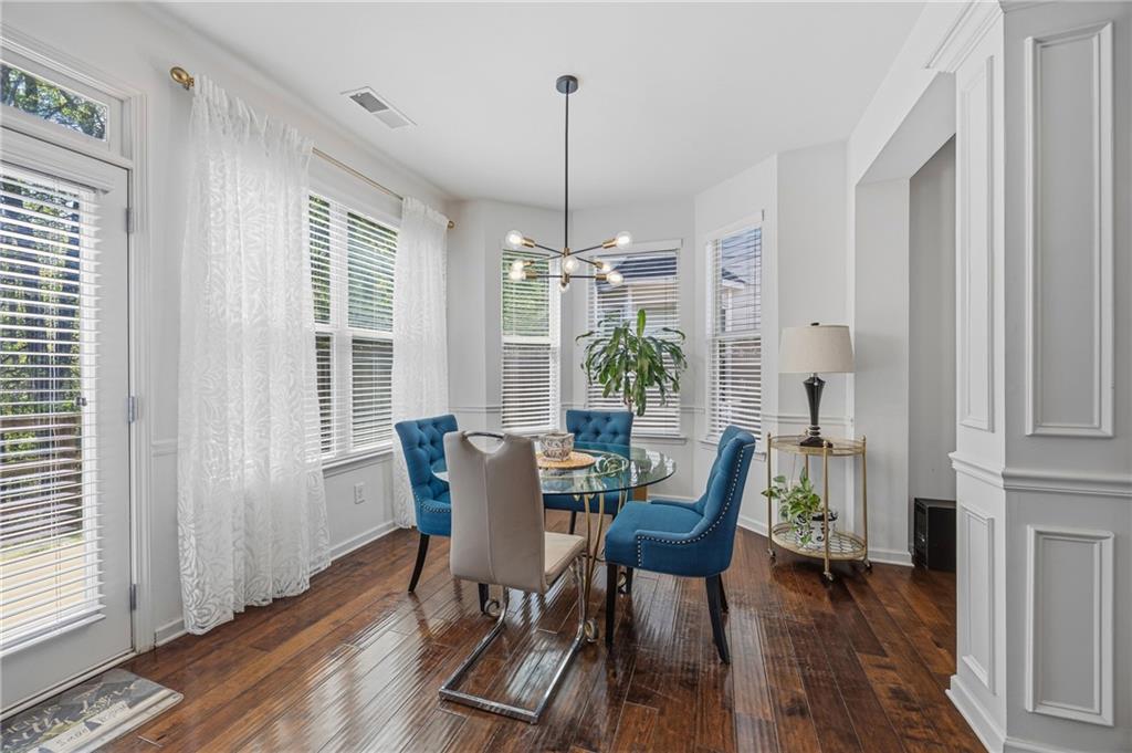 4021 Princeton Lakes Pass Southwest Atlanta, GA 30331 - Photo 6 of 23 a view of a dining room with furniture window and wooden floor