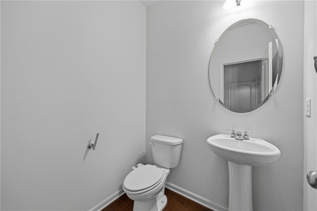 4021 Princeton Lakes Pass Southwest Atlanta, GA 30331 - Photo 9 of 23 a bathroom with a toilet sink and mirror