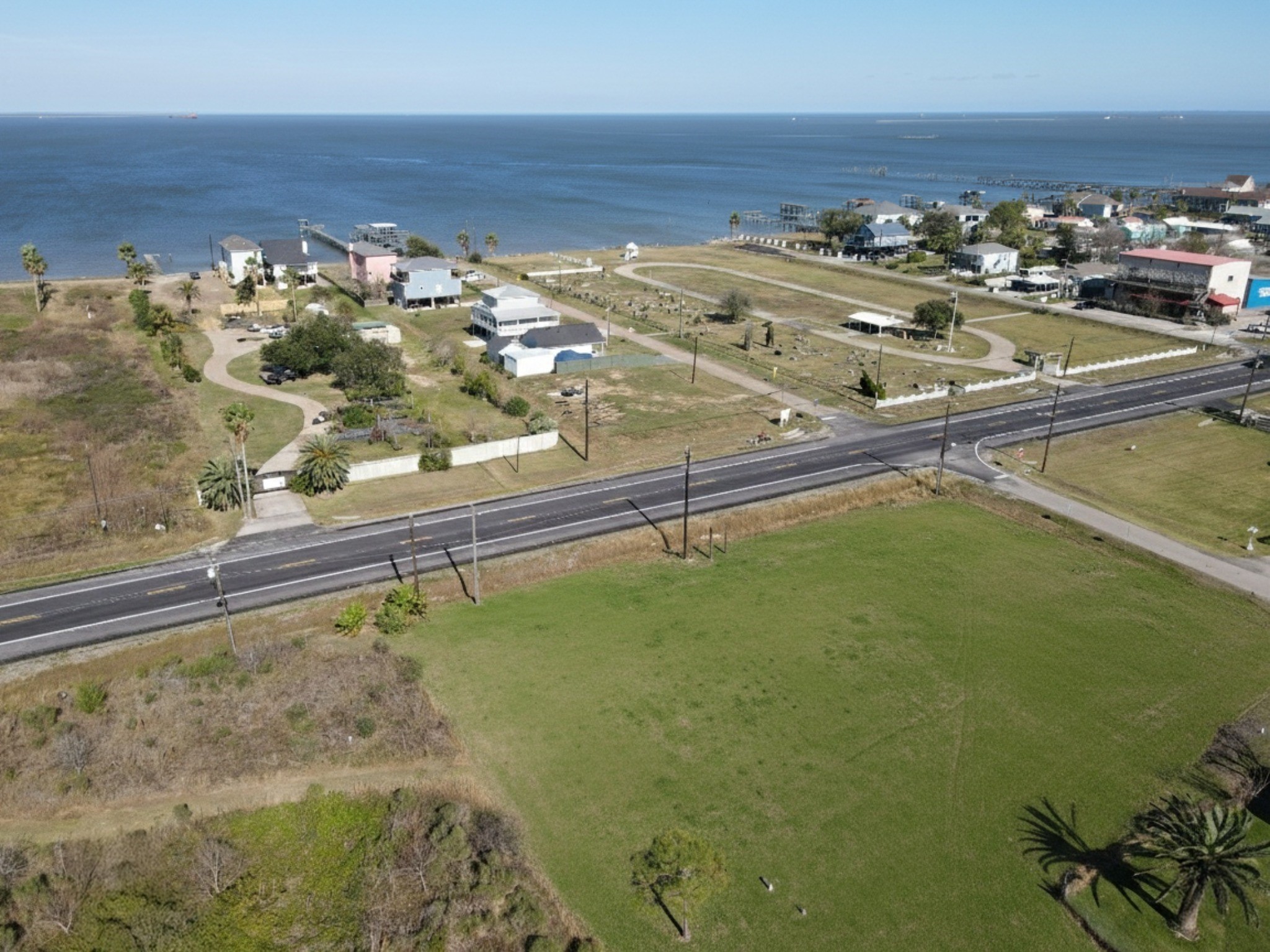 Property framed against the deep blue water of the bay.