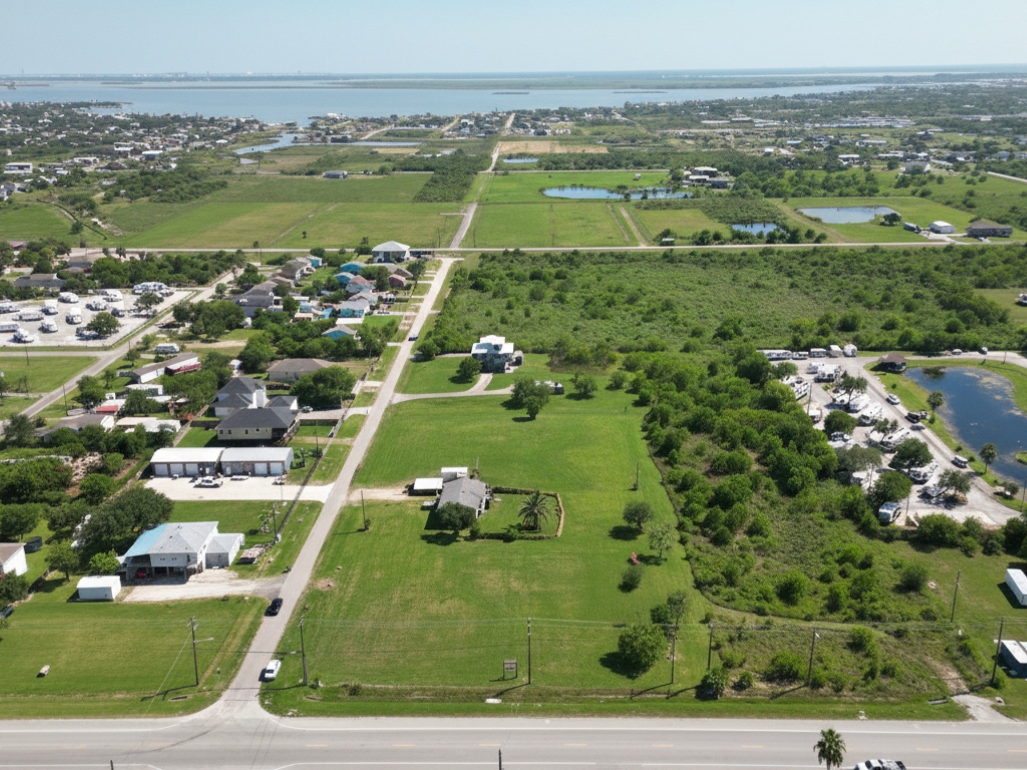 230 22nd Street Dickinson, TX 77539 - Photo 4 of 15 High-altitude view showing the full 1.9-acre corner and the path to the water.