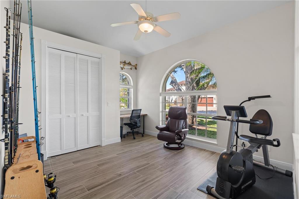 132 Wilderness Cay Naples, FL 34114 - Photo 16 of 24 a view of a room with gym equipment