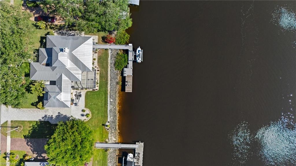 132 Wilderness Cay Naples, FL 34114 - Photo 2 of 24 an aerial view of a house with a yard