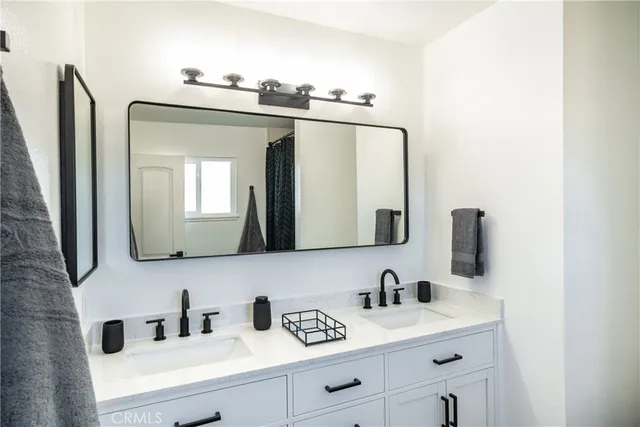 a bathroom with a glass shower door