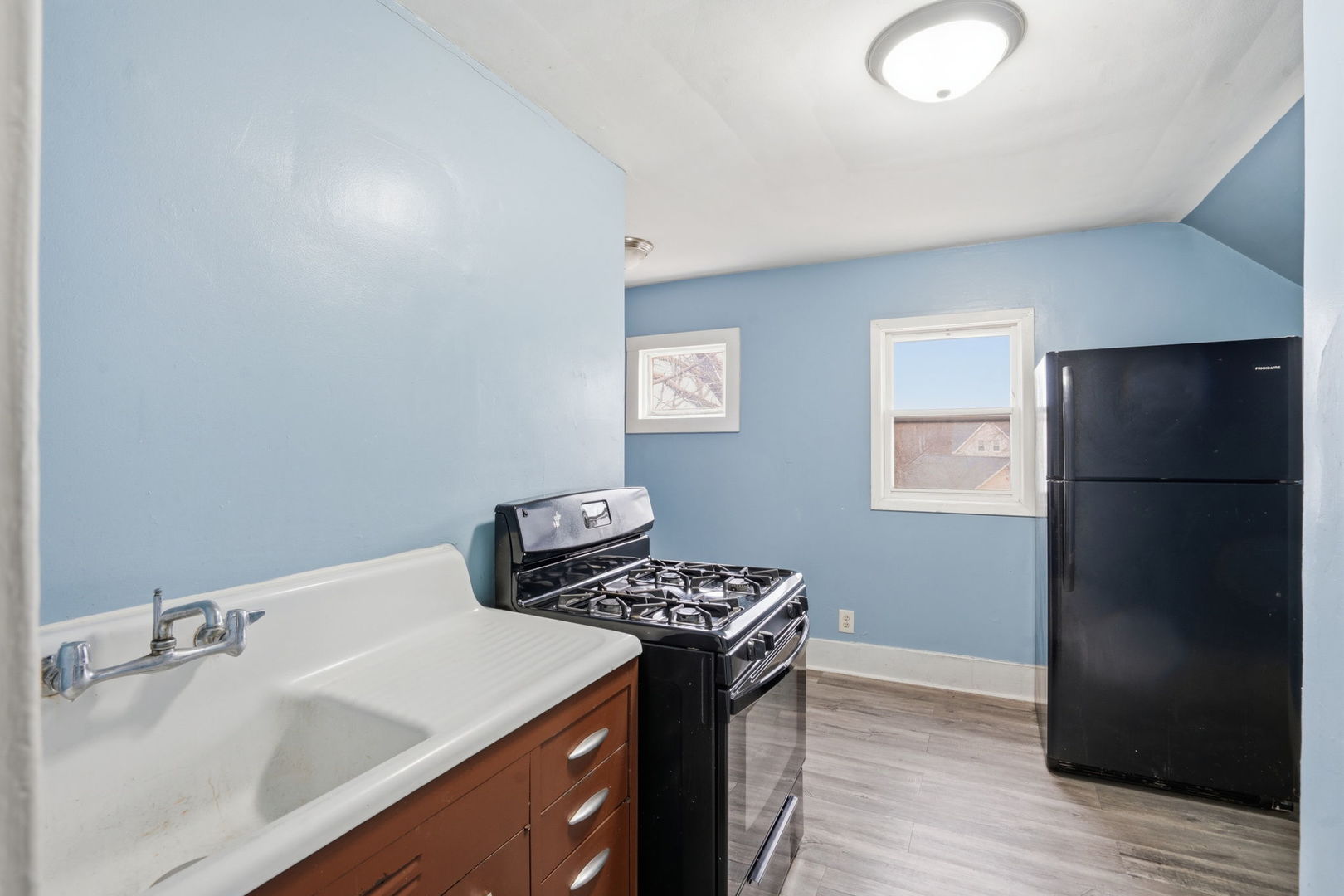 903 44th Street Rock Island, IL 61201 - Photo 19 of 28 a kitchen with a refrigerator and a sink