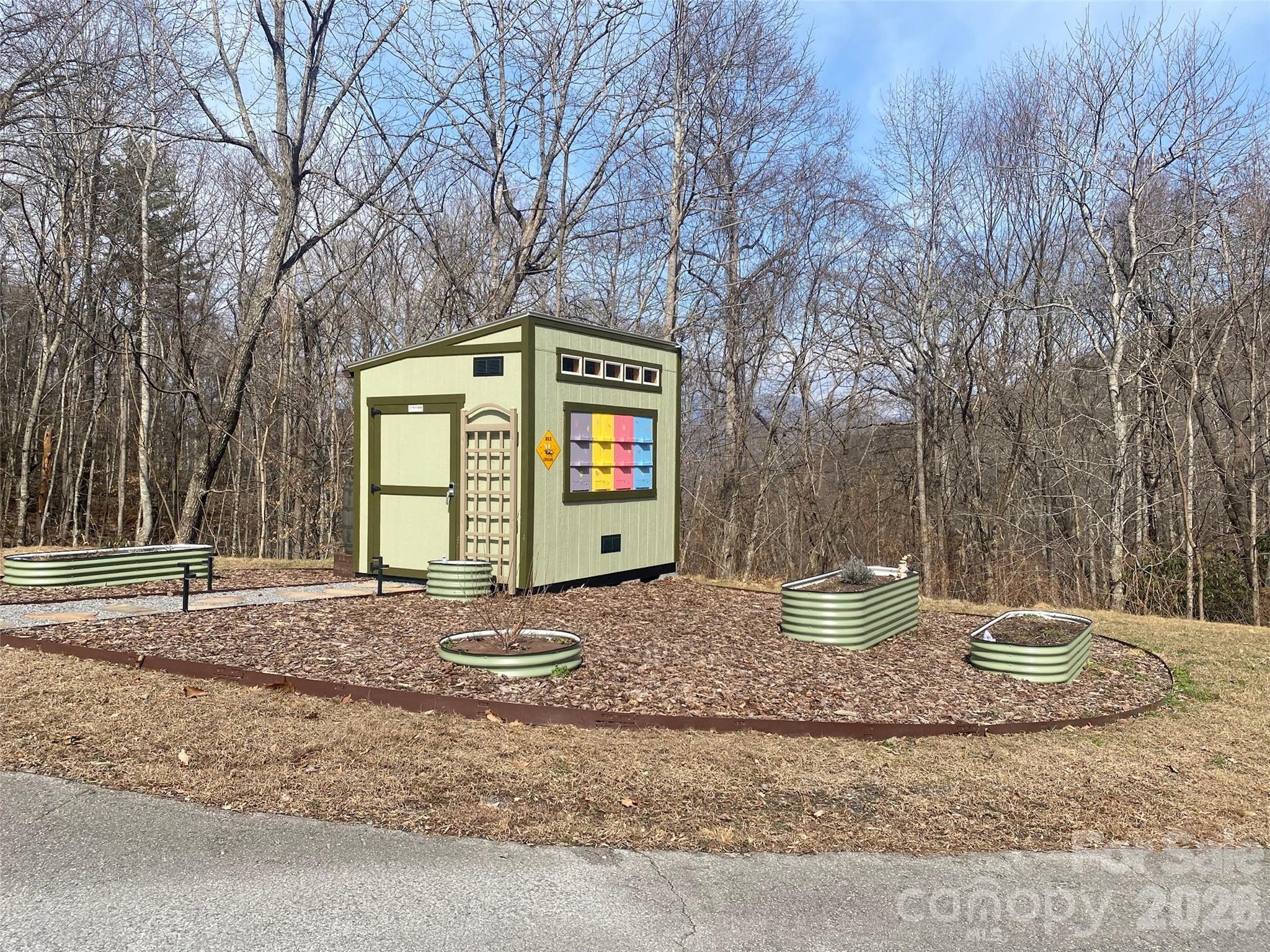 1394 Daydream Ridge Swannanoa, NC 28778 - Photo 27 of 31 a front view of a house with garden