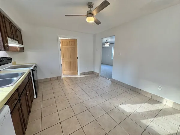 a view of a kitchen with storage and utility