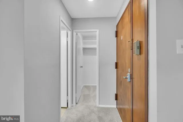 a view of a bathroom with a shower and a sink