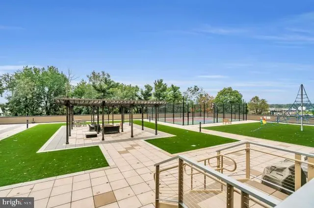 a view of a backyard with sitting area