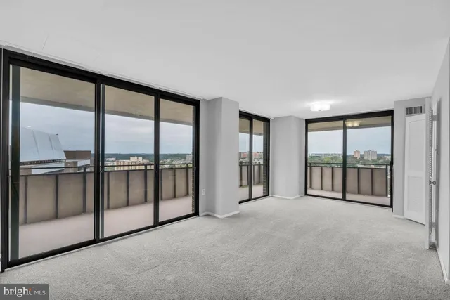 a view of an empty room with a large window