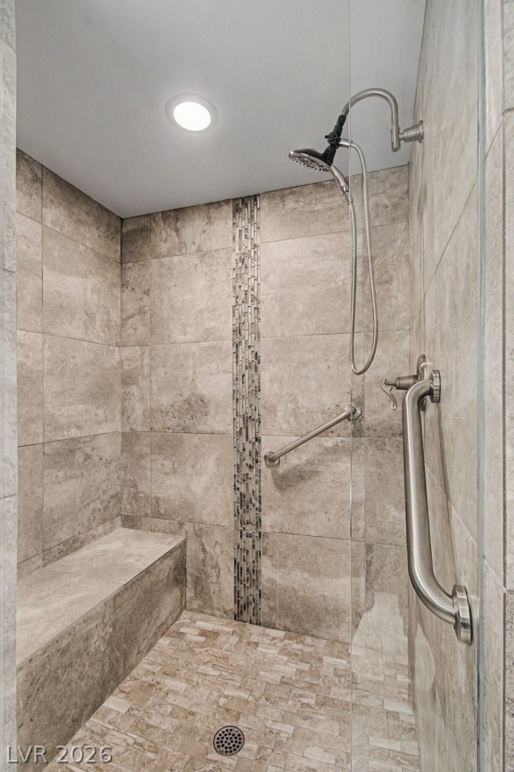 2555 Hampton Road, Unit 6308 Henderson, NV 89052 - Photo 20 of 30 A well-appointed shower offers convenient grab bars and a built-in bench for comfort.