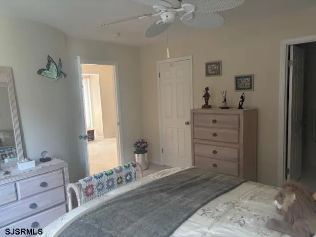 a vase of flowers sitting on a wooden floor
