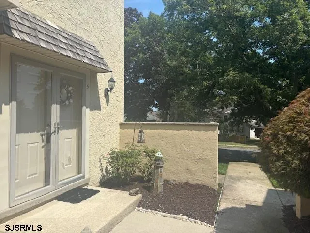 a view of a livingroom with furniture and staircase