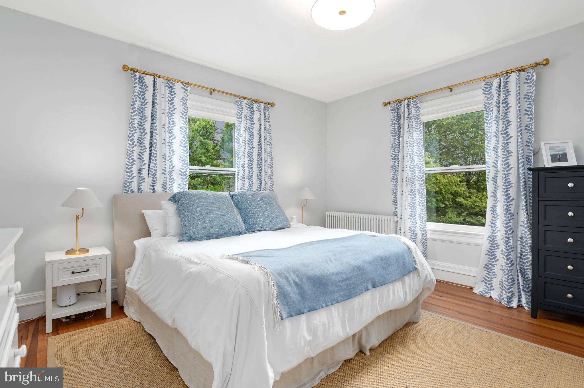 6515 Brookville Road Chevy Chase, MD 20815 - Photo 15 of 33 a bedroom with a bed and a window