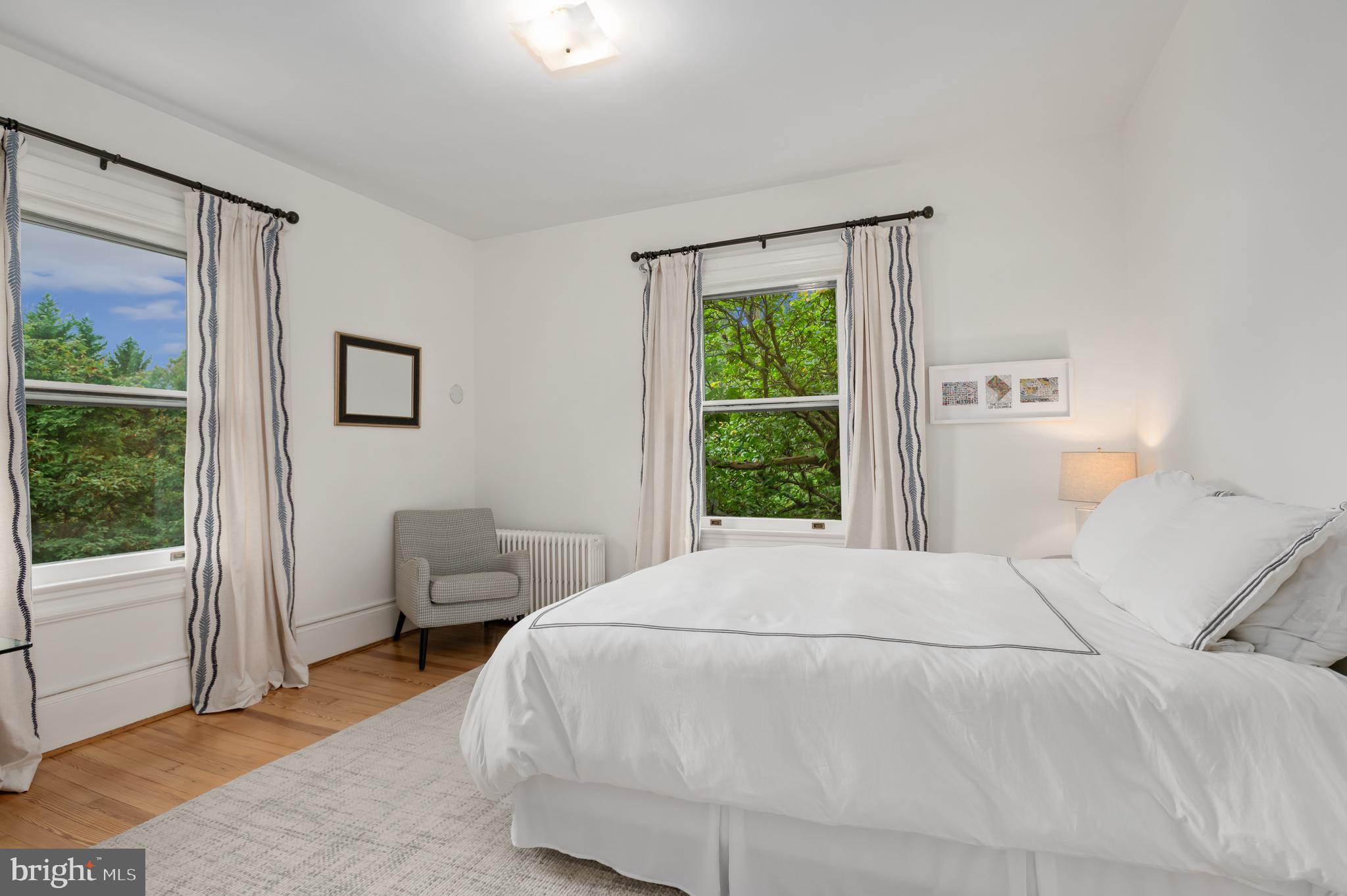 6515 Brookville Road Chevy Chase, MD 20815 - Photo 17 of 33 a bedroom with a bed and a window