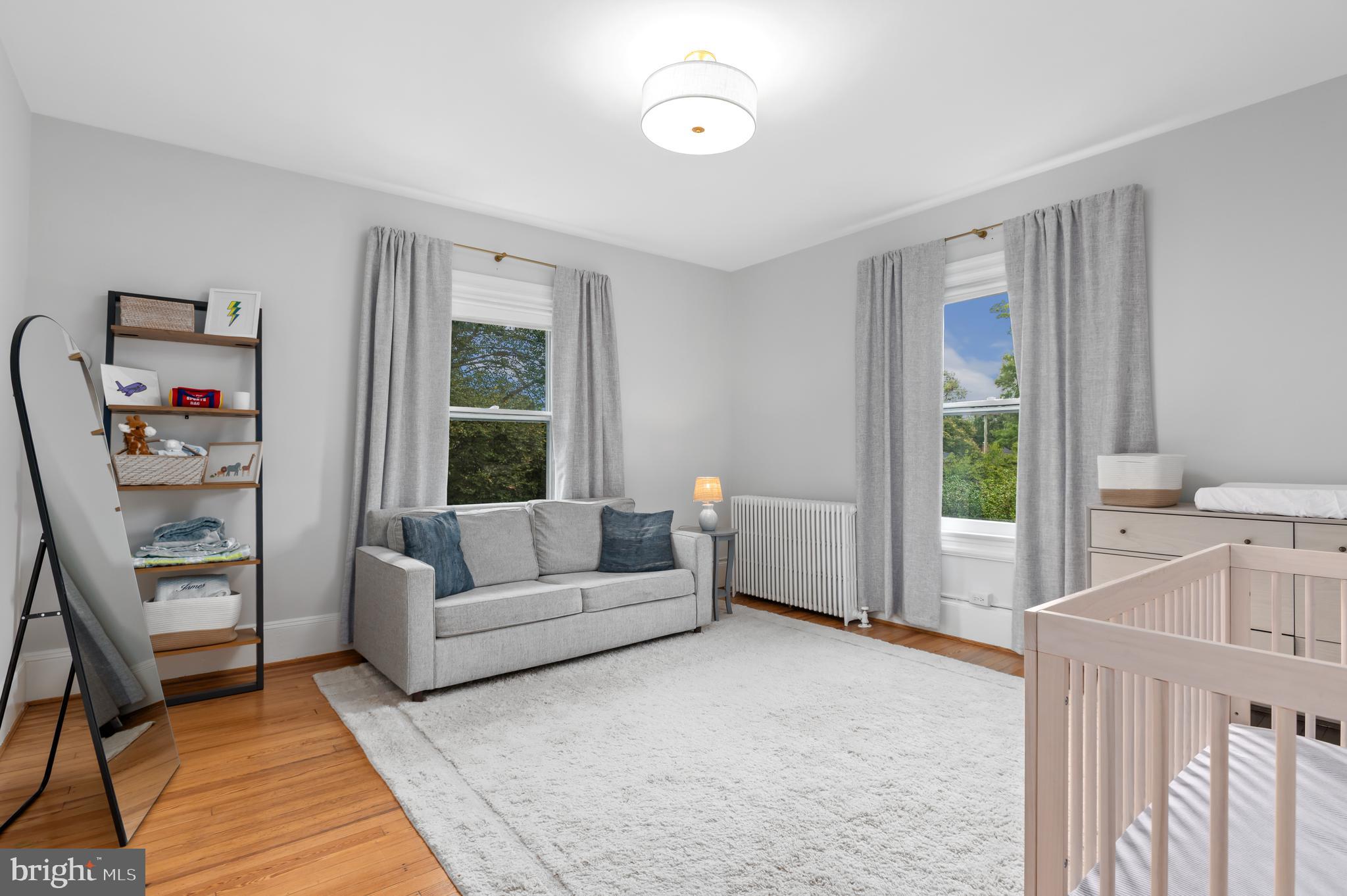 6515 Brookville Road Chevy Chase, MD 20815 - Photo 19 of 33 a living room with furniture and a window