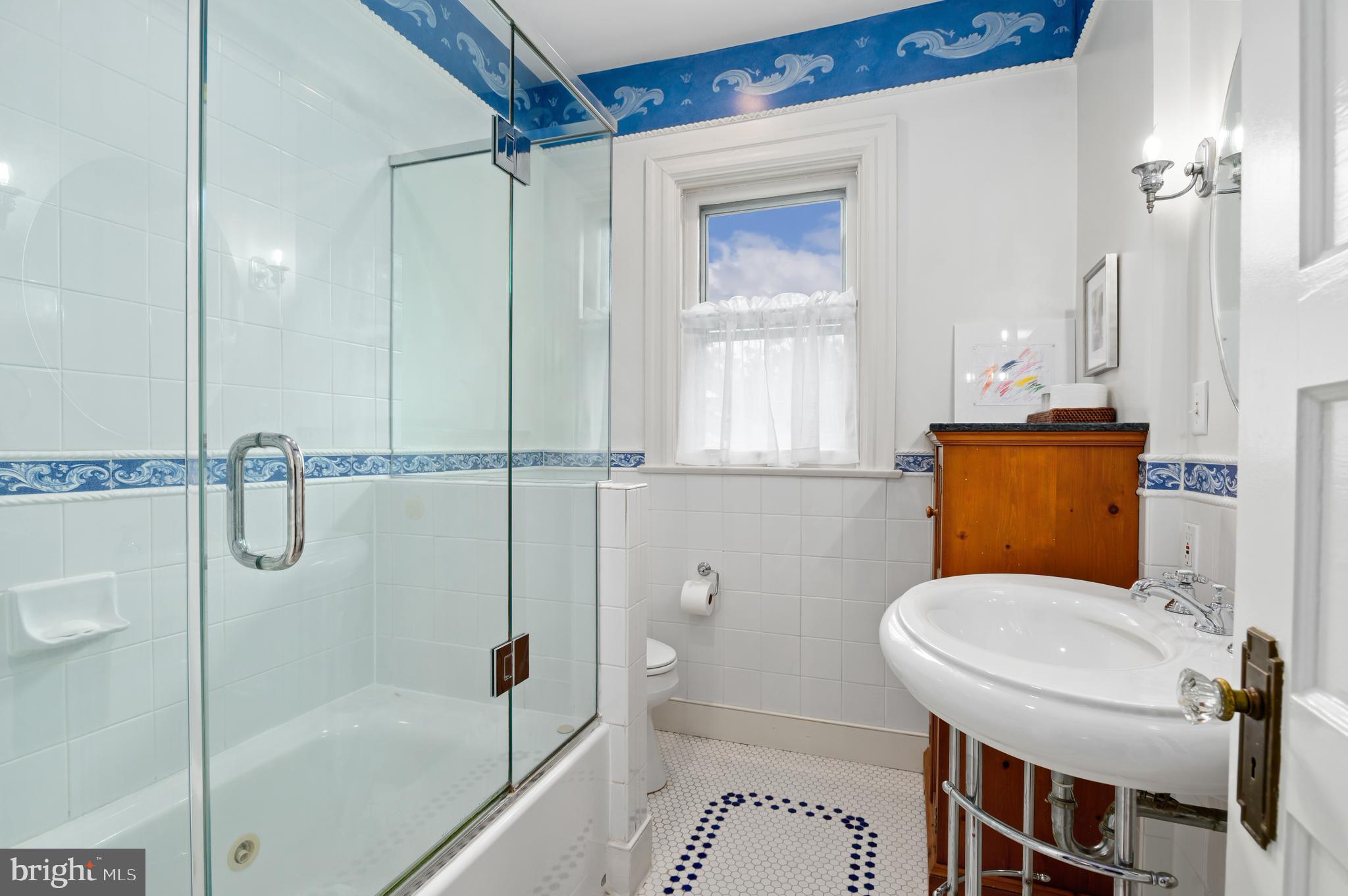 6515 Brookville Road Chevy Chase, MD 20815 - Photo 20 of 33 a bathroom with a toilet a sink and shower