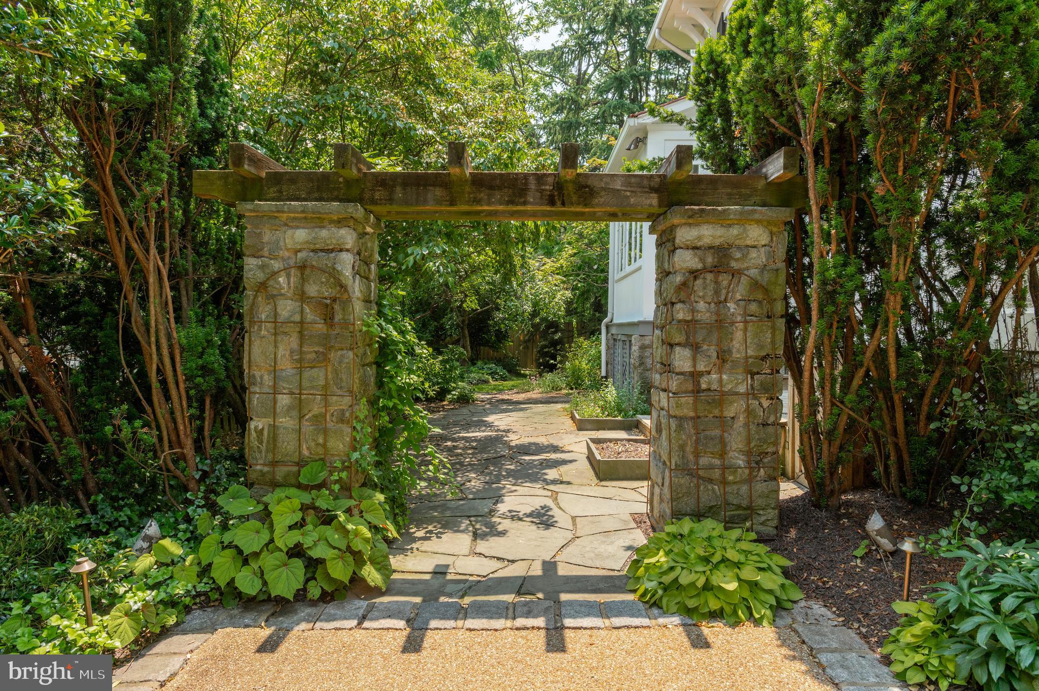 6515 Brookville Road Chevy Chase, MD 20815 - Photo 29 of 33 a backyard of a house with lots of green space