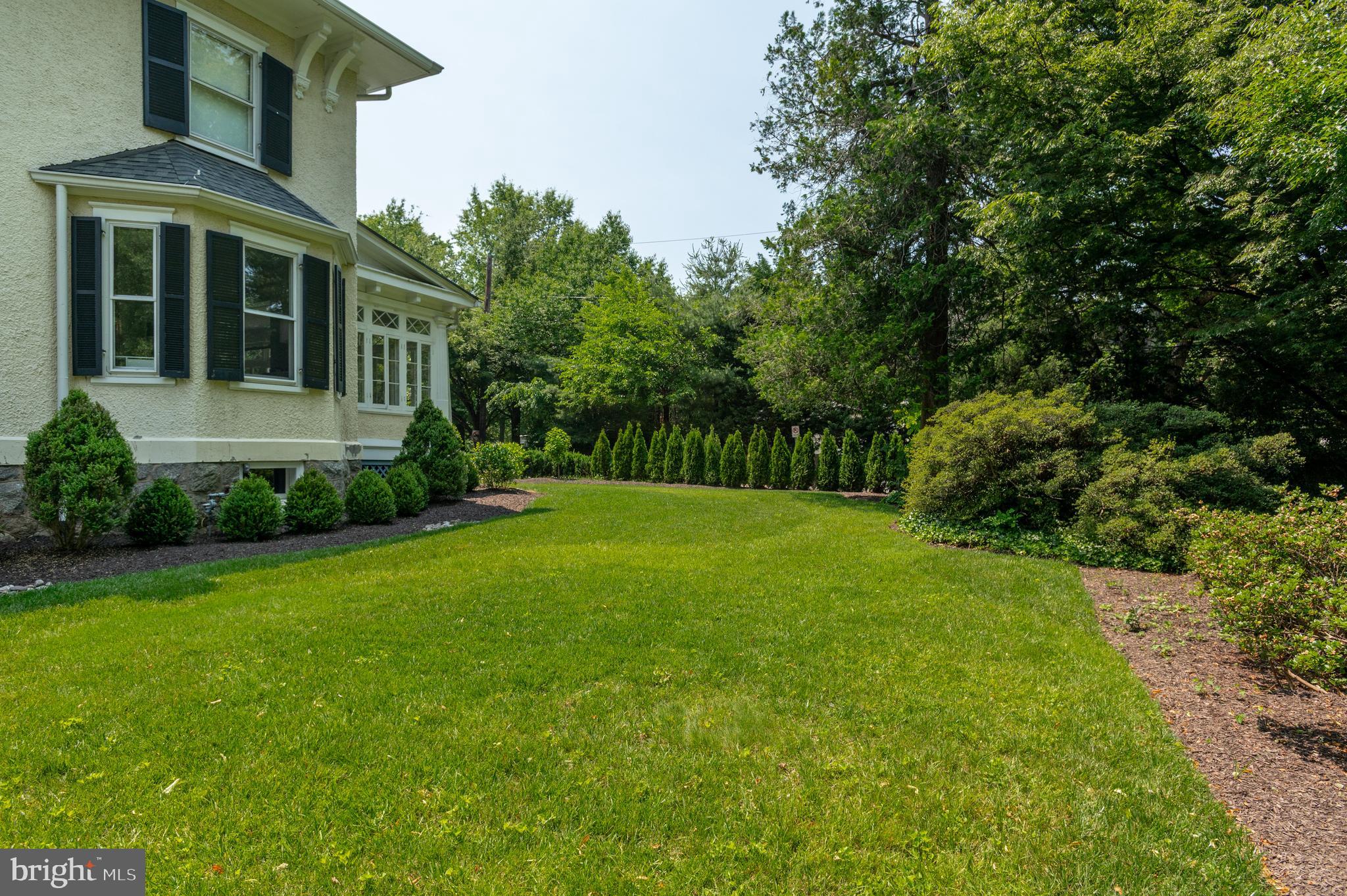 6515 Brookville Road Chevy Chase, MD 20815 - Photo 30 of 33 a view of a house with backyard and garden