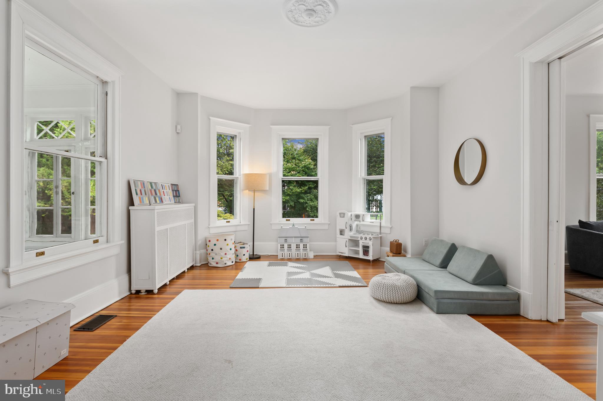 6515 Brookville Road Chevy Chase, MD 20815 - Photo 10 of 33 a spacious bedroom with furniture and a large window