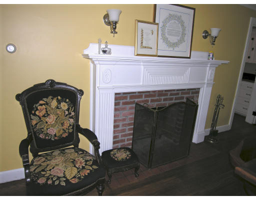 3 Frances Needham, MA 02492 - Photo 3 of 15 a front view of a fireplace