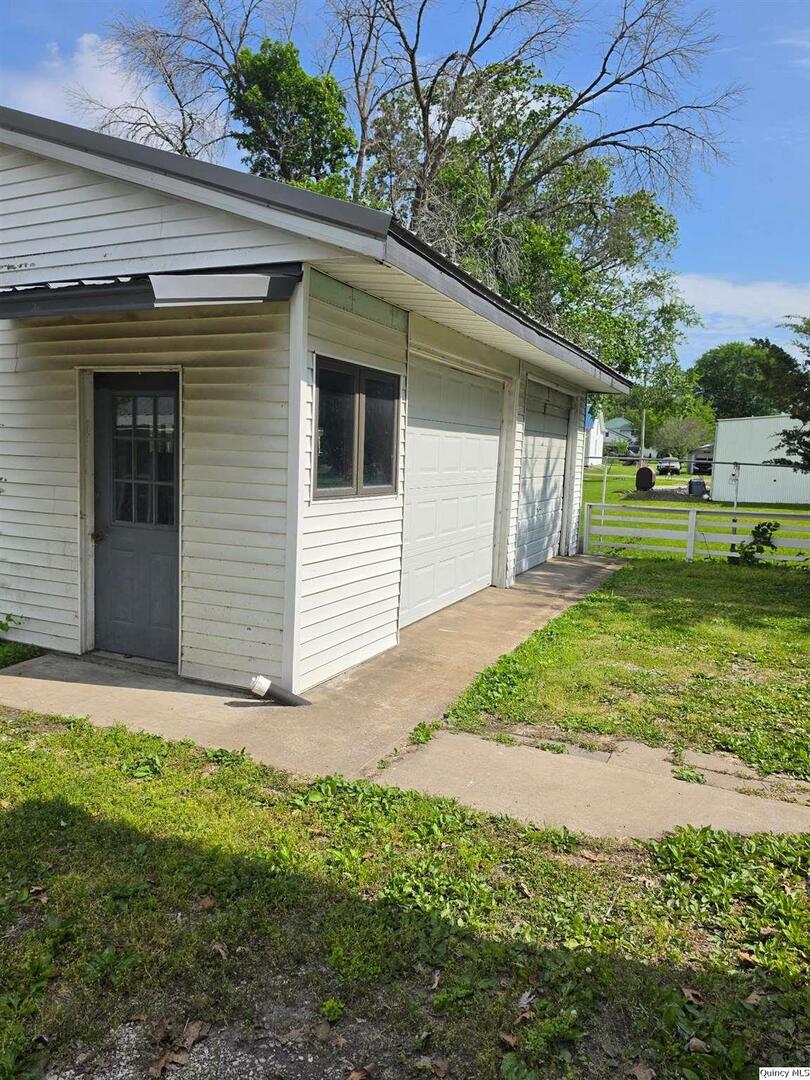 304 West 3rd Street Golden, IL 62339 - Photo 16 of 18 a view of a house with a yard