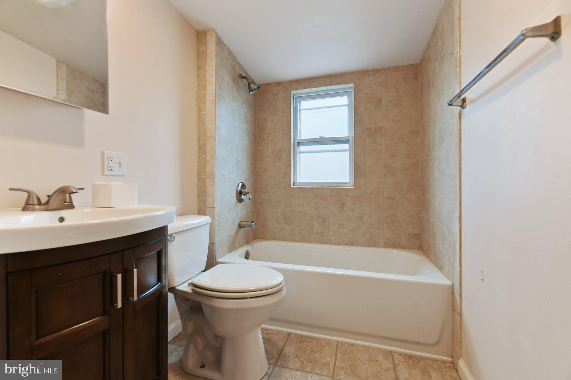 4 Plateau Road Baltimore, MD 21221 - Photo 16 of 19 a bathroom with a sink toilet and bathtub