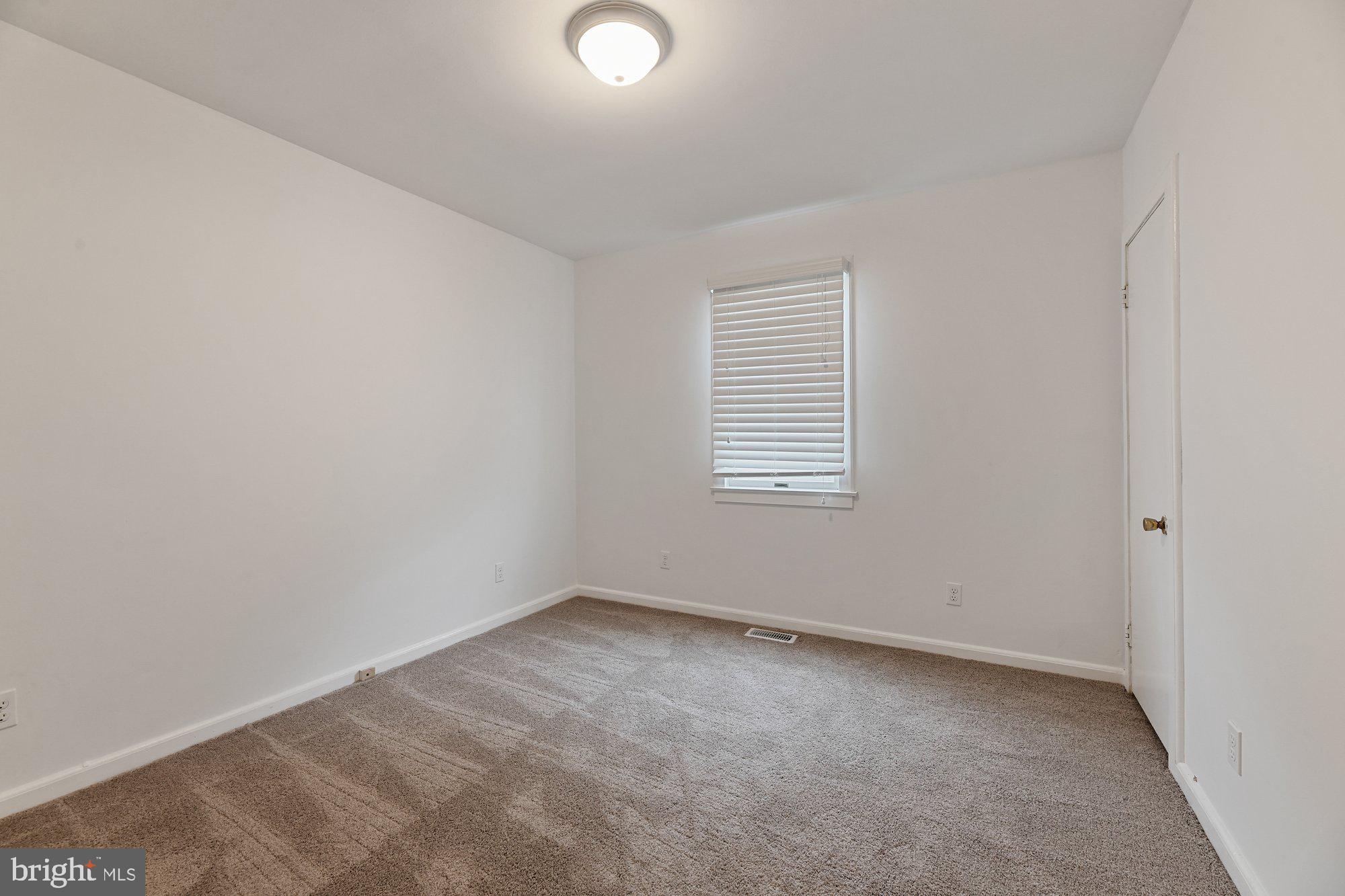 4 Plateau Road Baltimore, MD 21221 - Photo 9 of 19 an empty room with a window