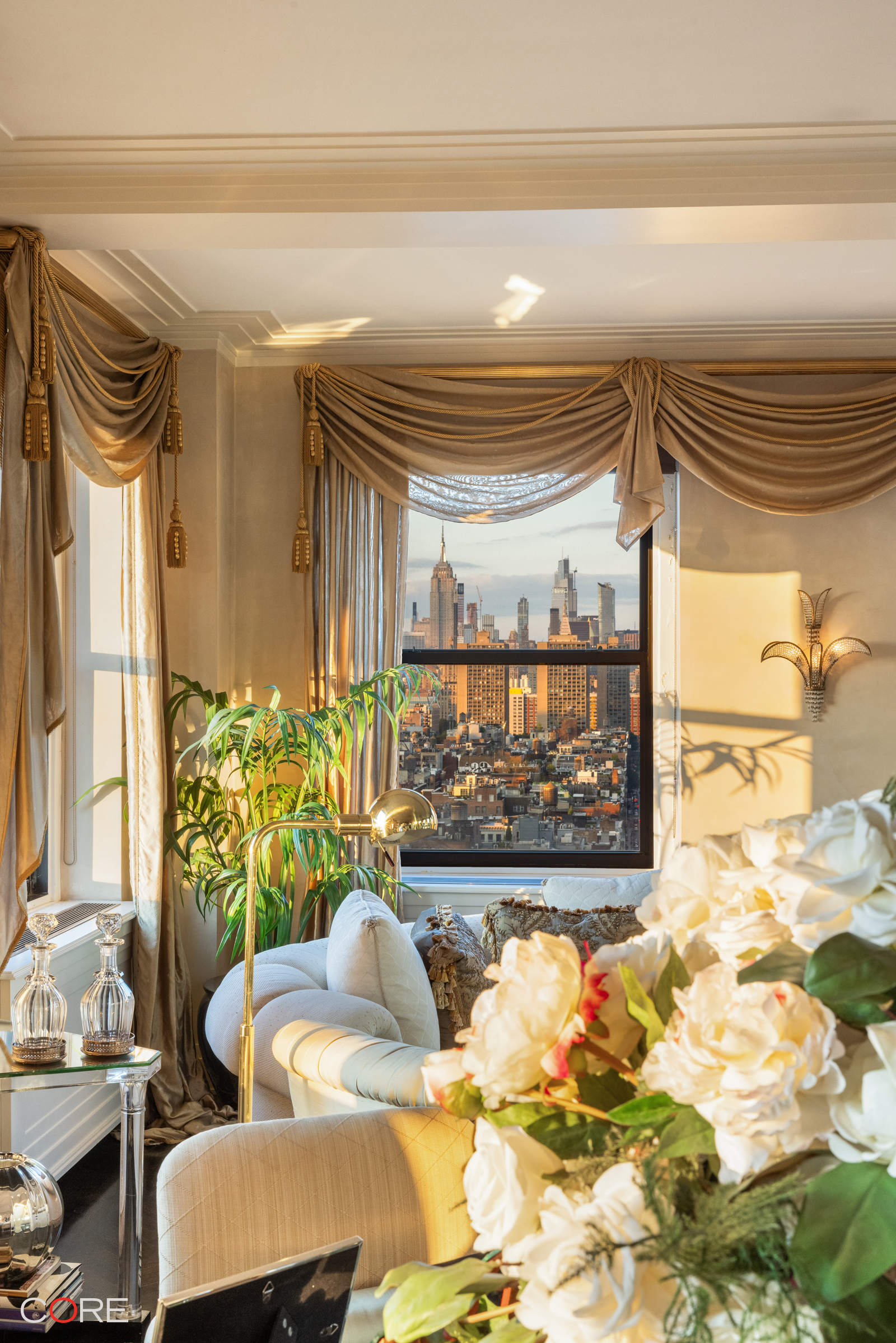 90 Franklin Street, Unit PH Manhattan, NY 10013 - Photo 9 of 25 a living room with furniture and a large window