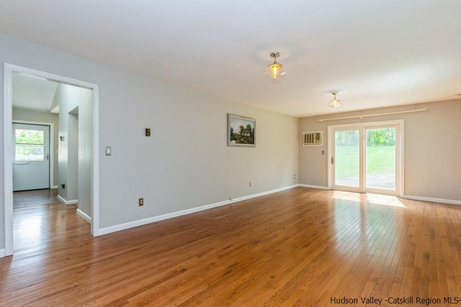 37 Michael Drive Cottekill, NY 12419 - Photo 11 of 30 an empty room with wooden floor and windows