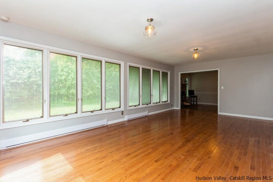 37 Michael Drive Cottekill, NY 12419 - Photo 12 of 30 a view of empty room with wooden floor and fan