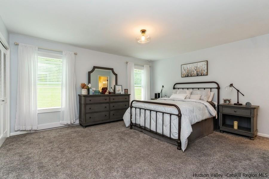 37 Michael Drive Cottekill, NY 12419 - Photo 15 of 30 a spacious bedroom with a bed and a window